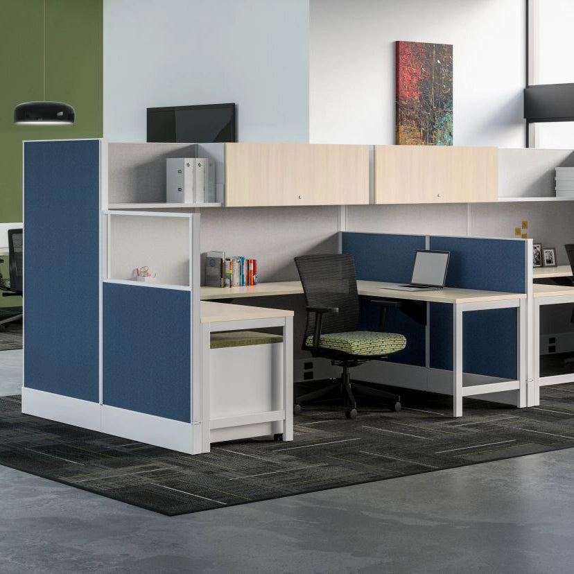 Modern office setup with blue and white partitioned workstations. Kansas City Office Design