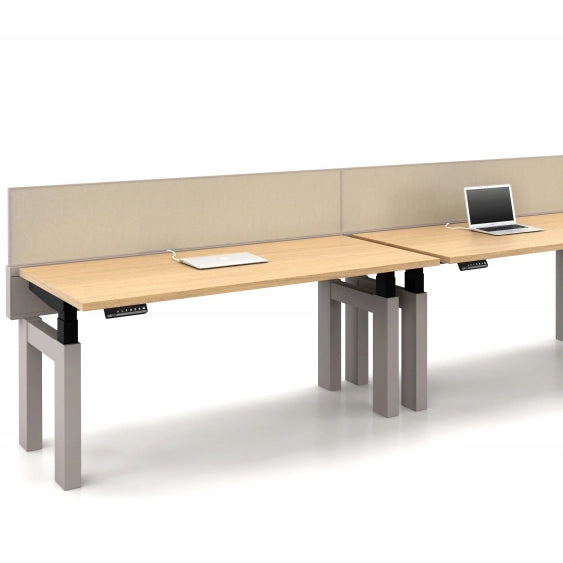 Modern office power bench sit to stand desk with partition and laptop on a white background. Configured in a single run. Kansas City Office Design.