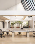 Modern office space with Power Bench sit to stand desks and chairs, large windows, and a view of trees. Kansas City Office Design.