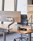 Office with the Humanscale M10 single monitor arm back view on desk. Kansas City Office Design.