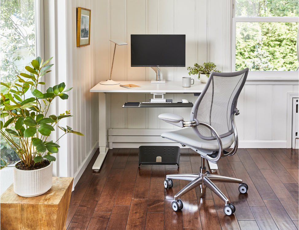 Modern home office with a desk, chair, and Humanscale footrest. Kansas City Office Design.  