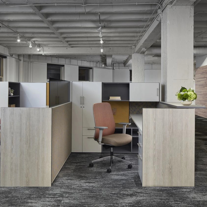 Modern office space with cubicles and a chair. Kansas City Office Design
