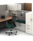 Modern office cubicle with desk, chair, and storage cabinets. Kansas City Office Design