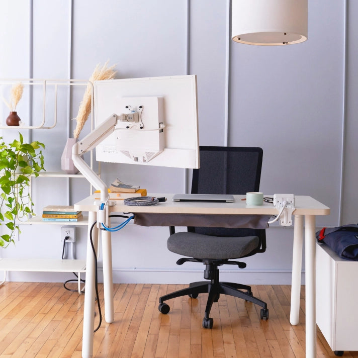 Modern home office with a desk, chair, and computer setup. Kansas City Office Design.