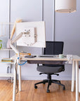 Modern home office with a desk, chair, and computer setup. Kansas City Office Design.