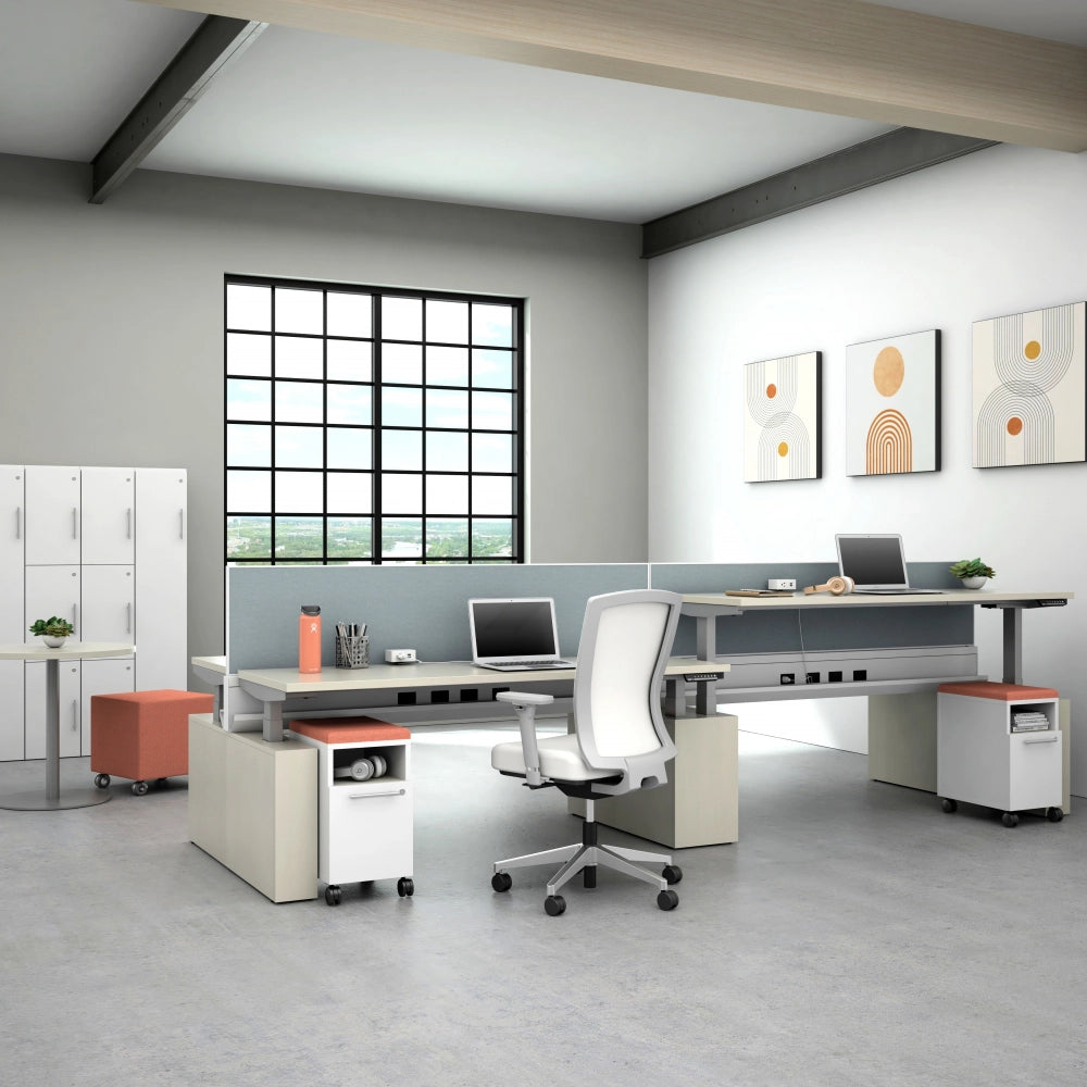 Modern office space with a power bench sit to stand desk, chairs, and decor. Kansas City Office Design.