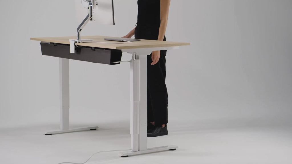 Video of a height adjustable desk with the HumanScale NeatTech Cable Management System. Kansas City Office Furniture