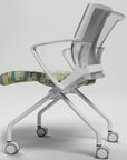 Modern office chair with white frame and patterned seat on a light gray background. Kansas City Office Design.