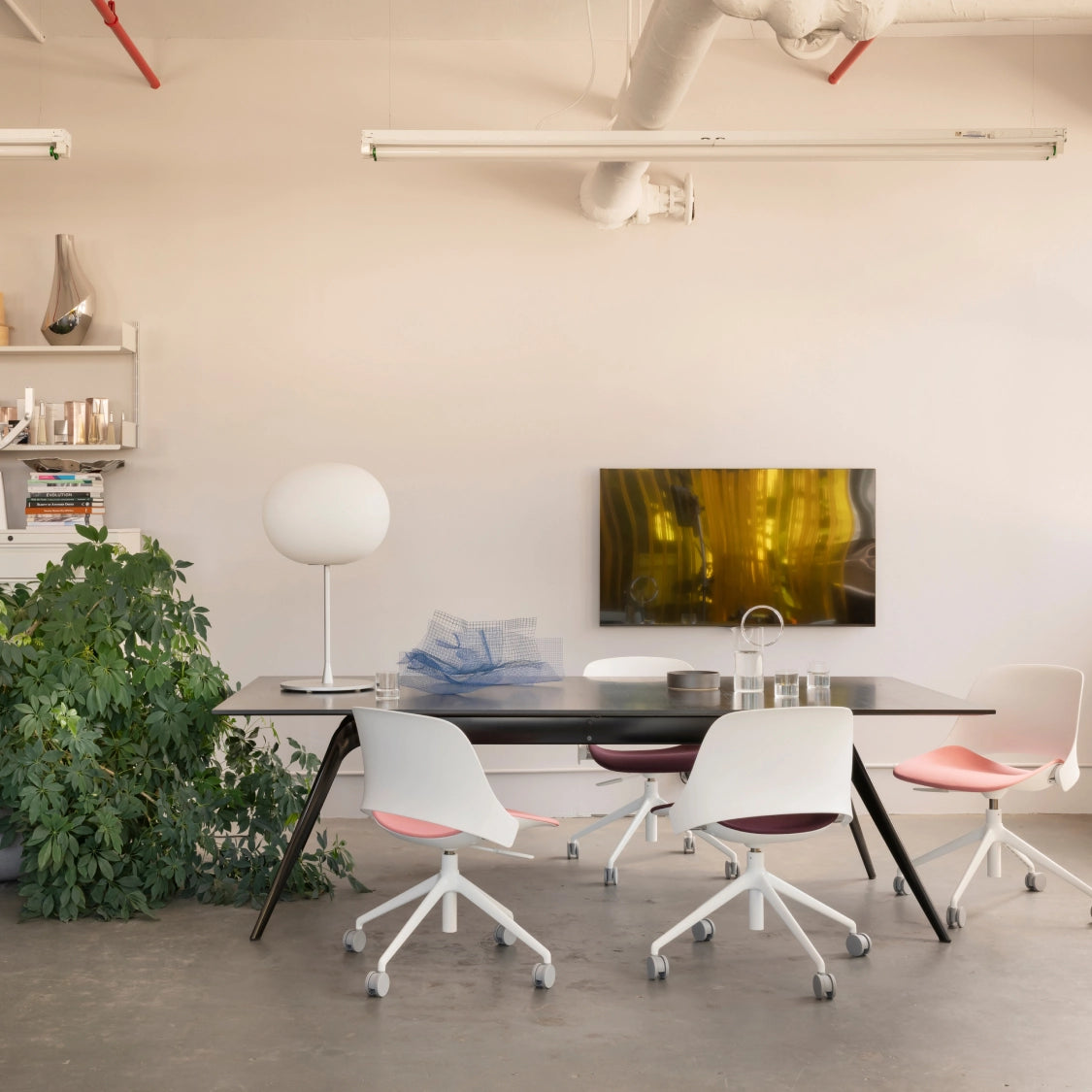 Modern office space with a desk, chairs, and decorative elements. Kansas City Office Design