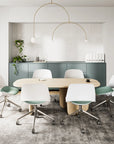 Modern conference room with a round wooden table and white chairs. Kansas City Office Design