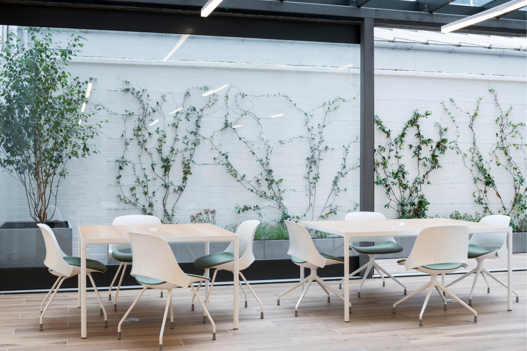 Humanscale Trea Chairs used in café-style collaborative workspace. Kansas City Office Furniture.